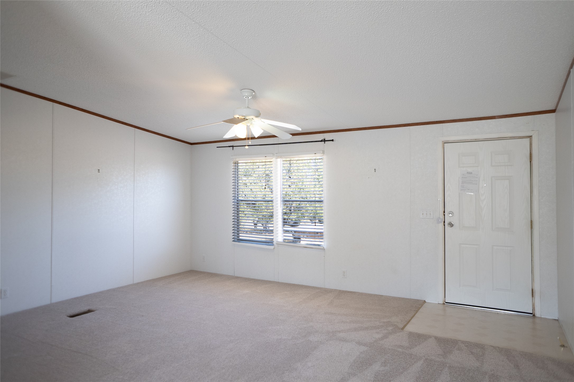 1149 Hart Lane Dripping Springs, TX 78620 - Photo 8 of 17 an empty room with a empty space and windows