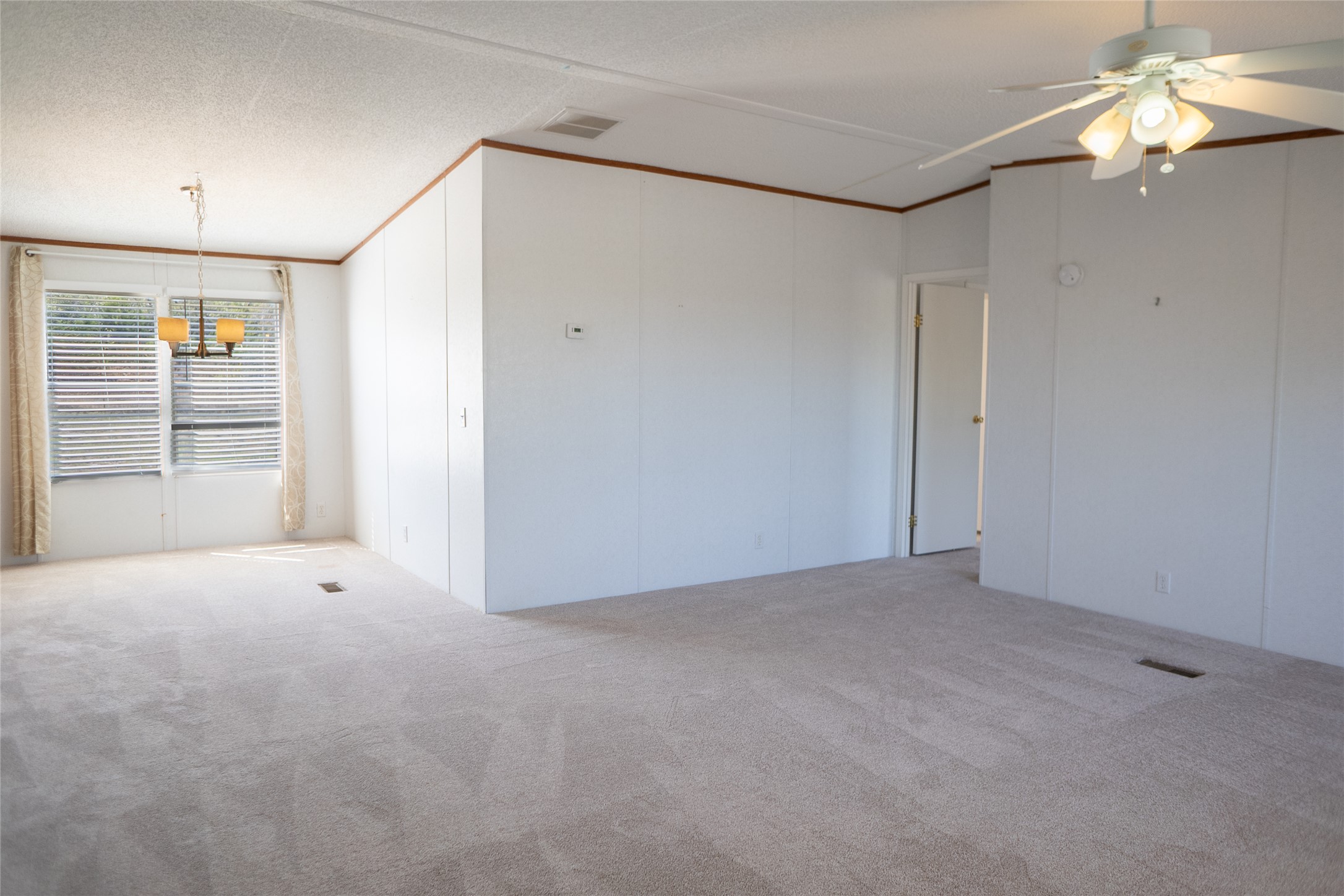 1149 Hart Lane Dripping Springs, TX 78620 - Photo 9 of 17 a view of an empty room with a window
