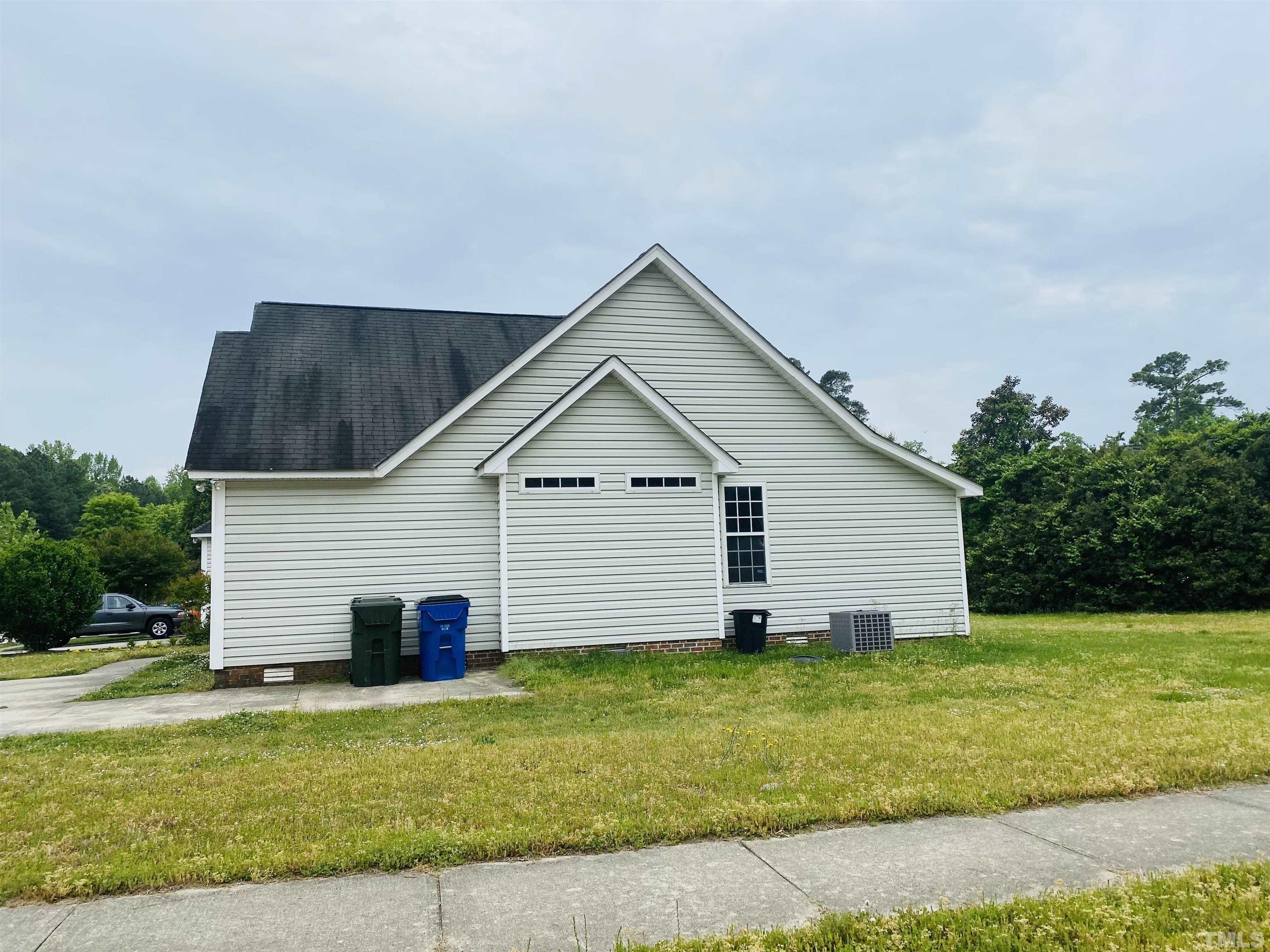 4217 Archibald Way Raleigh, NC 27616 - Photo 2 of 3 a view of a house with backyard