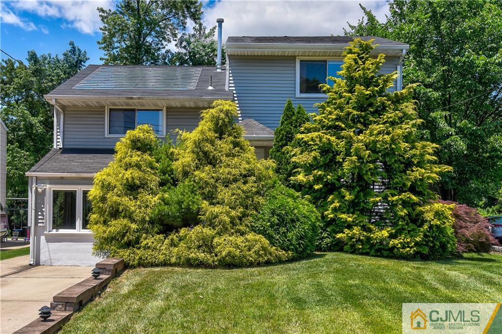 221 North Hill Road Colonia, NJ 07067 - Photo 1 of 25 a front view of a house with garden