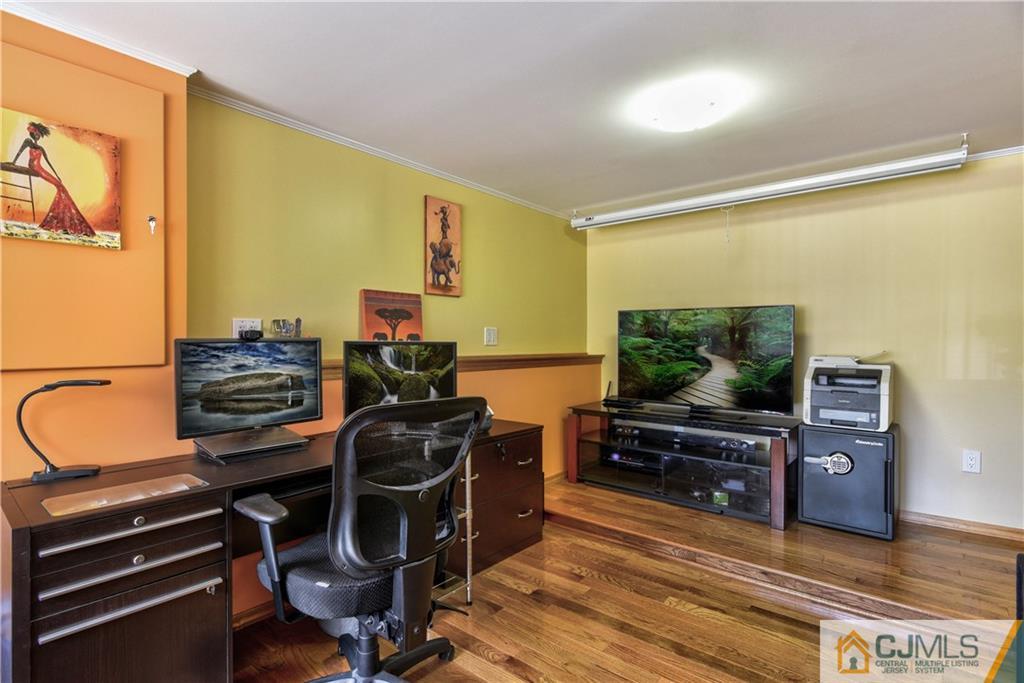 221 North Hill Road Colonia, NJ 07067 - Photo 14 of 25 a room with furniture and flat screen tv