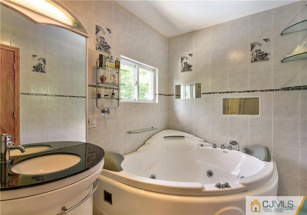 221 North Hill Road Colonia, NJ 07067 - Photo 20 of 25 a bathroom with a sink and a toilet