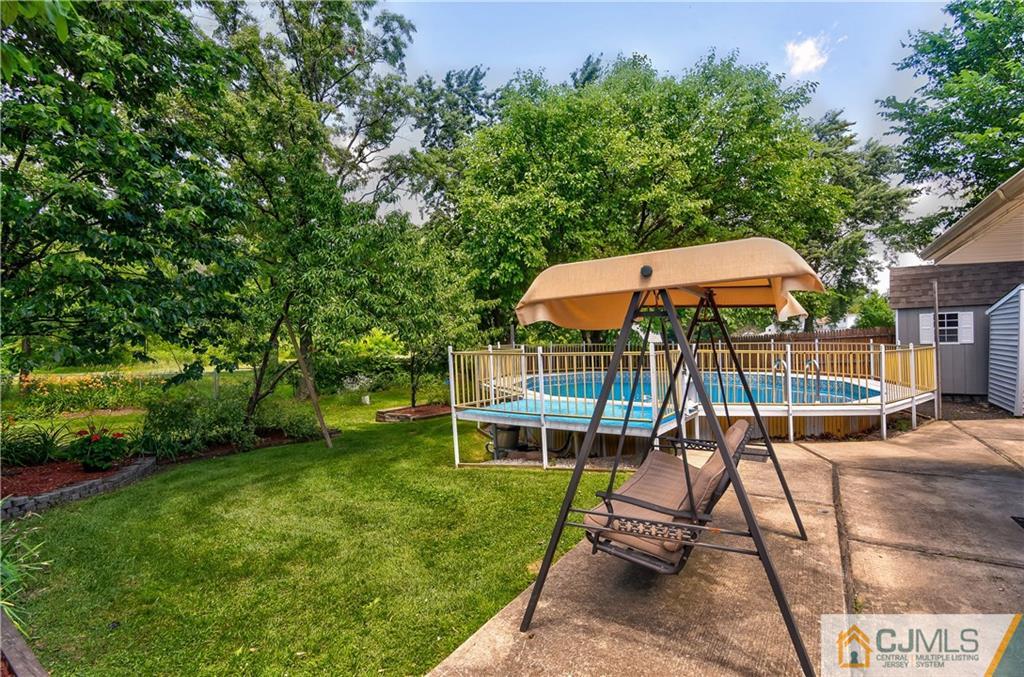 221 North Hill Road Colonia, NJ 07067 - Photo 24 of 25 a view of a house with a yard porch and sitting area