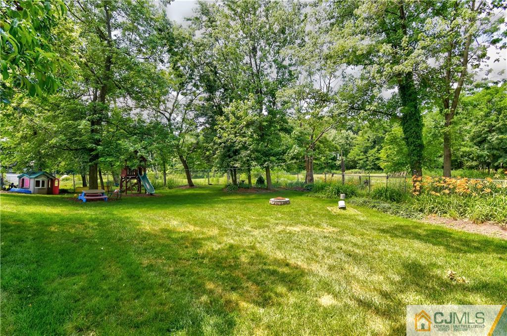 221 North Hill Road Colonia, NJ 07067 - Photo 25 of 25 a view of outdoor space with deck and yard