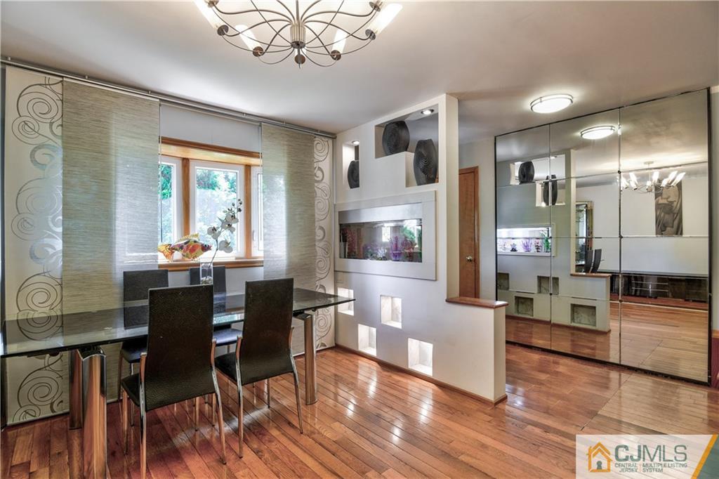 221 North Hill Road Colonia, NJ 07067 - Photo 5 of 25 a view of a dining room with furniture window and wooden floor