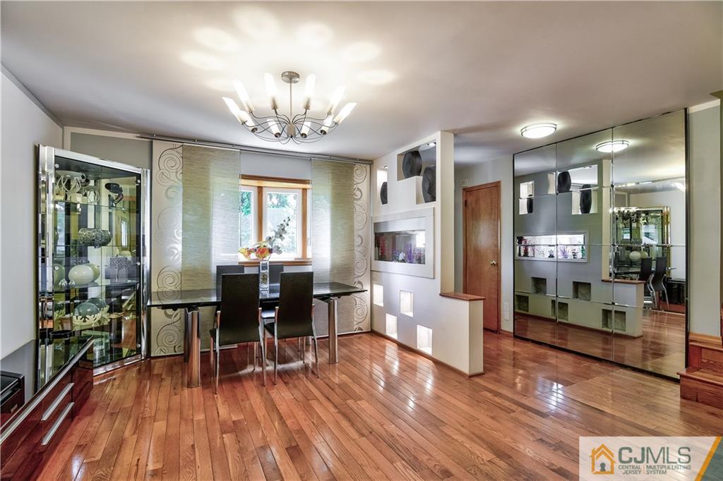 221 North Hill Road Colonia, NJ 07067 - Photo 6 of 25 a view of a dining room with furniture window and wooden floor