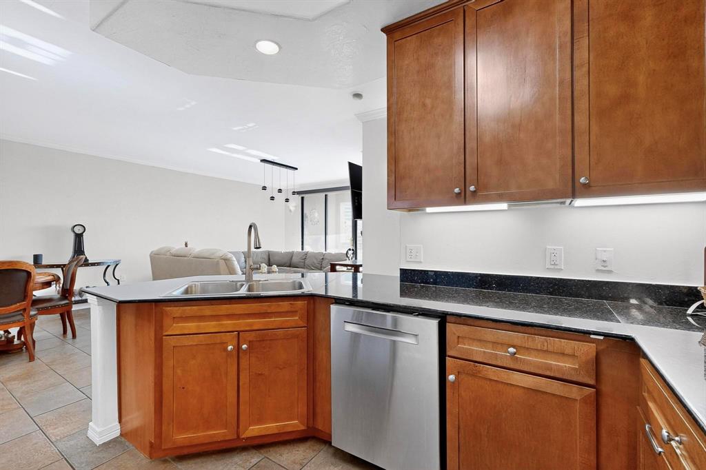 330 Las Colinas Boulevard East, Unit 1116 Irving, TX 75039 - Photo 36 of 36 a kitchen with stainless steel appliances granite countertop a sink stove and cabinets