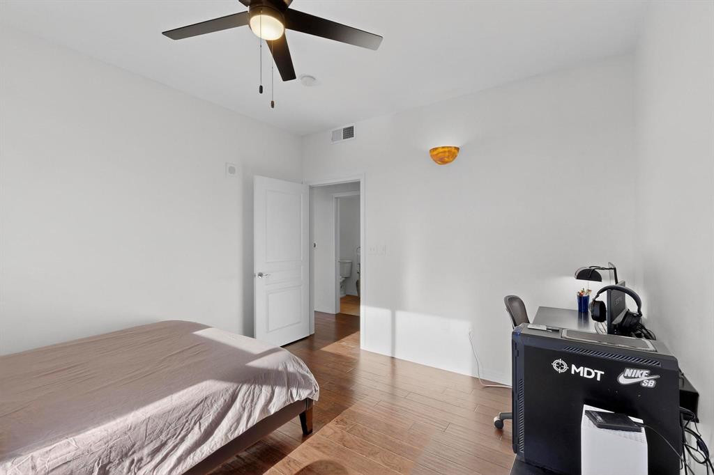 330 Las Colinas Boulevard East, Unit 1116 Irving, TX 75039 - Photo 18 of 36 a bedroom with a bed and cabinets