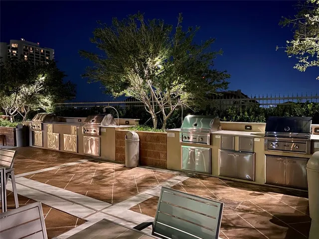a view of a swimming pool with outdoor seating