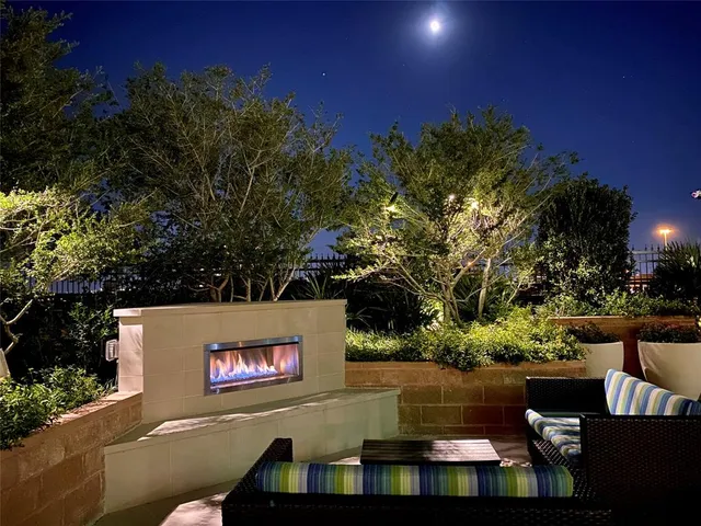 a wooden bench sitting in front of a building