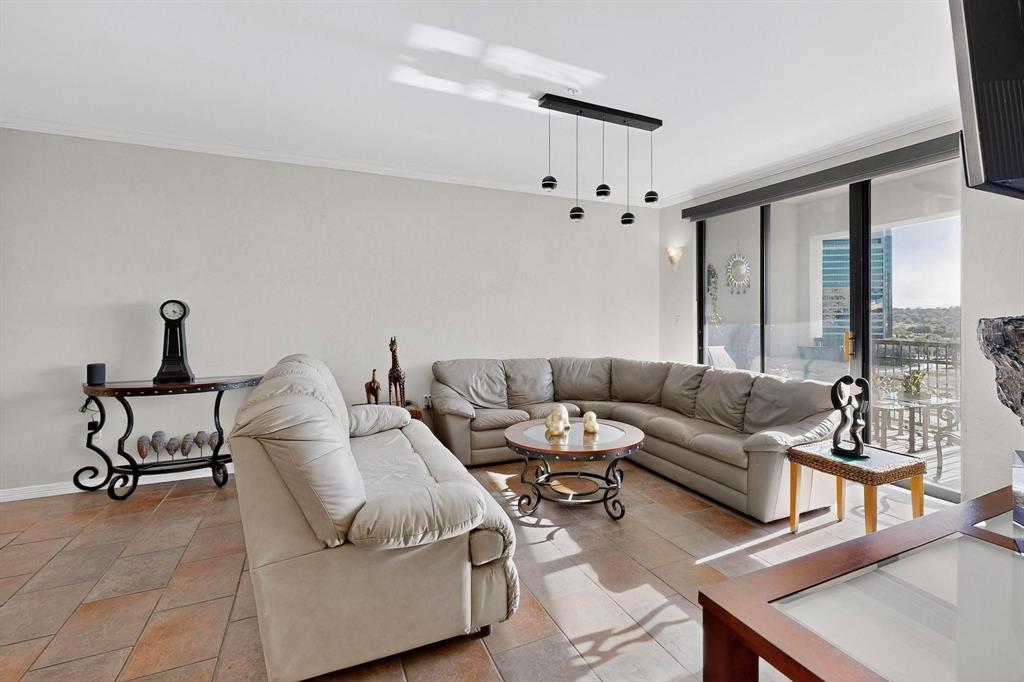 330 Las Colinas Boulevard East, Unit 1116 Irving, TX 75039 - Photo 4 of 36 a living room with furniture and a large window