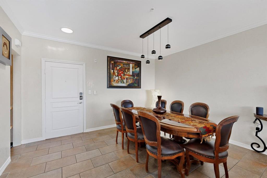 330 Las Colinas Boulevard East, Unit 1116 Irving, TX 75039 - Photo 5 of 36 a view of a dining room with furniture and chandelier