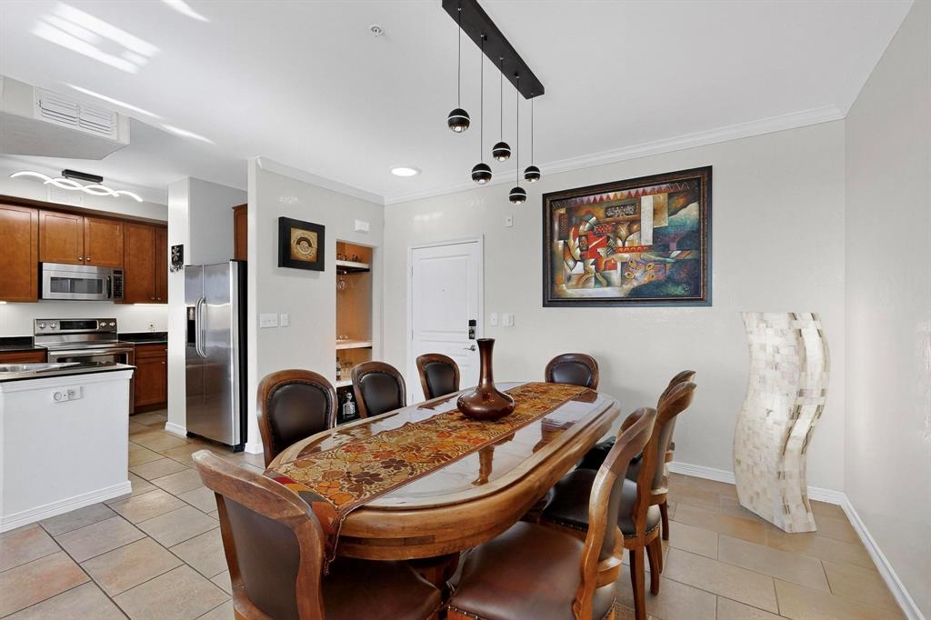 330 Las Colinas Boulevard East, Unit 1116 Irving, TX 75039 - Photo 6 of 36 a view of a dining room with furniture