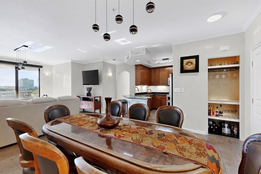 330 Las Colinas Boulevard East, Unit 1116 Irving, TX 75039 - Photo 7 of 36 a large kitchen with a table and chairs