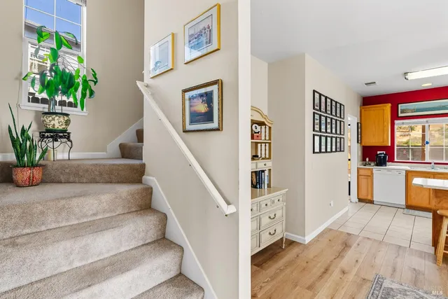 a view of living room with furniture and a potted plant