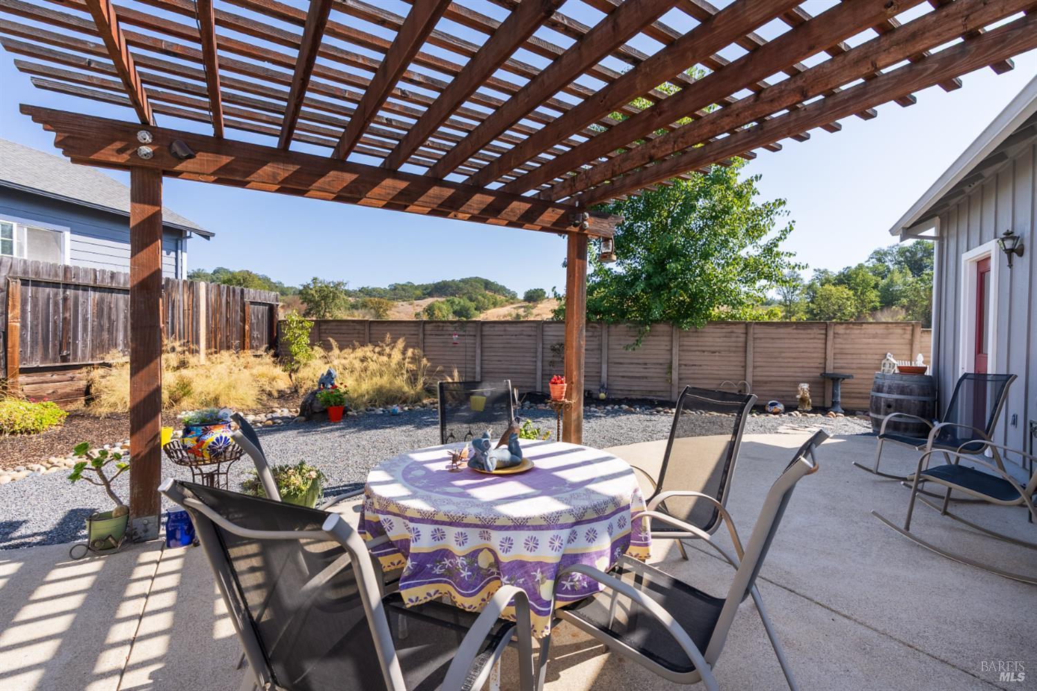 1724 Palomino Court Healdsburg, CA 95448 - Photo 25 of 30 a patio with glass top table and chairs