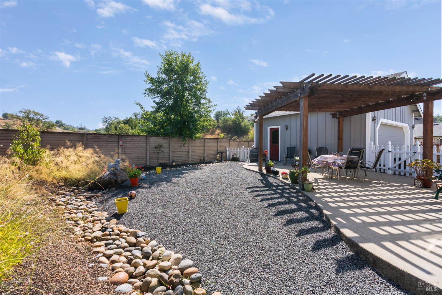 1724 Palomino Court Healdsburg, CA 95448 - Photo 26 of 30 a view of a house with backyard and sitting area