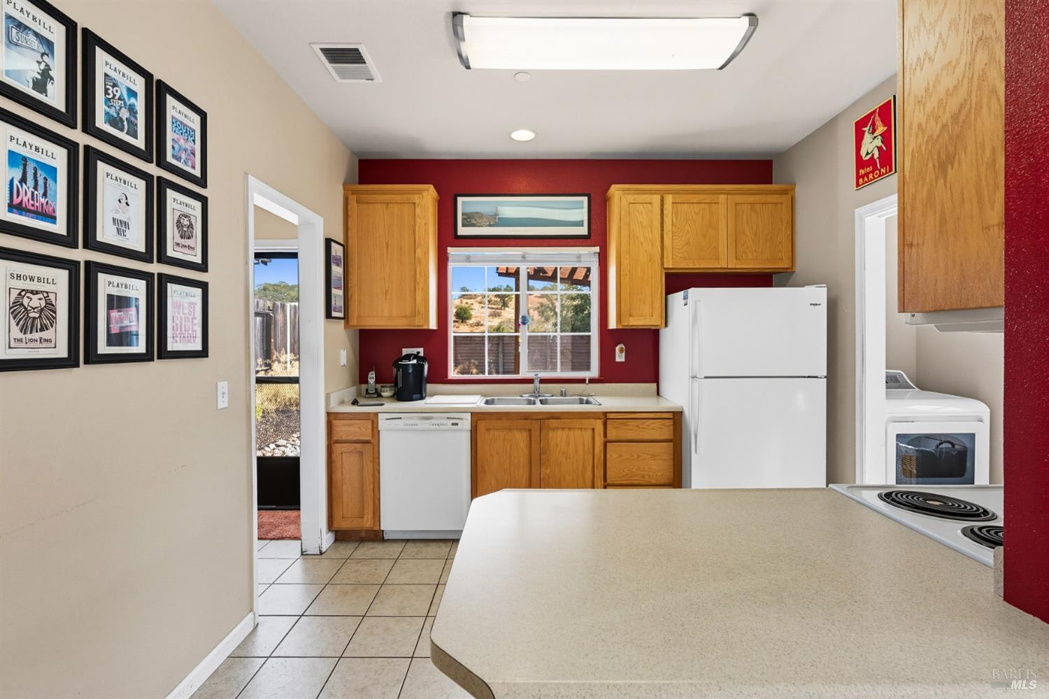 1724 Palomino Court Healdsburg, CA 95448 - Photo 9 of 30 a kitchen with a refrigerator and a stove top oven