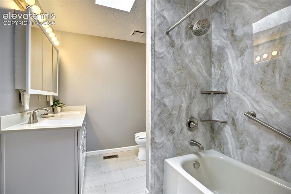 7585 Ponca Road Colorado Springs, CO 80908 - Photo 21 of 49 Brand new full bath, main level hallway