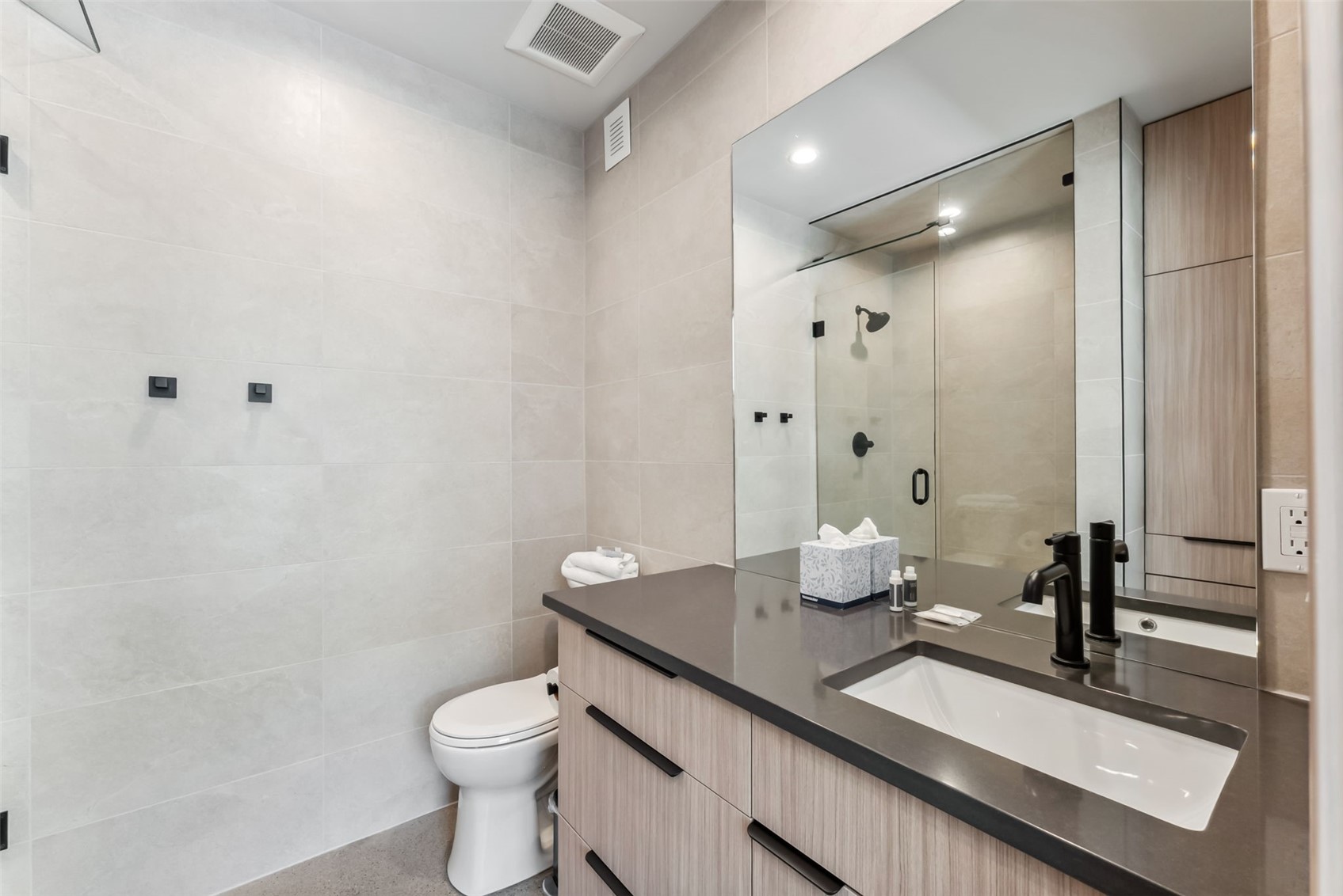 96 River Run Road, Unit A Keystone, CO 80435 - Photo 27 of 50 a bathroom with a granite countertop sink toilet and shower