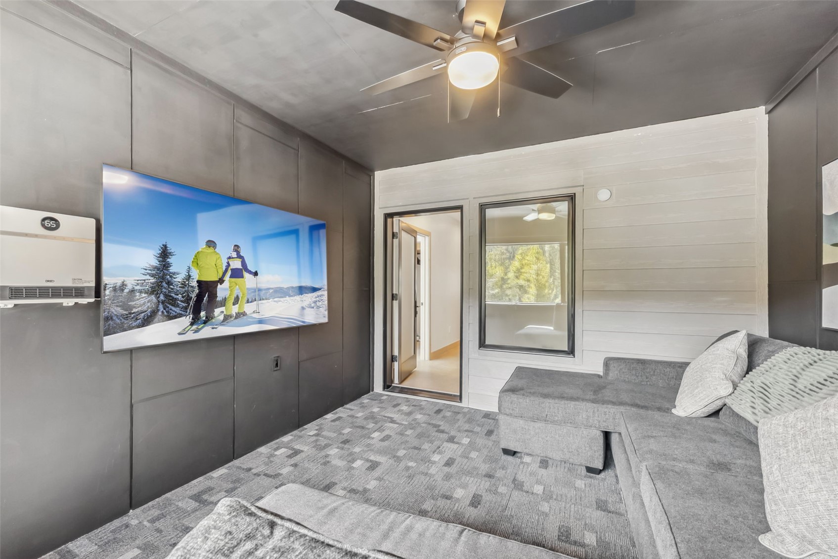 96 River Run Road, Unit A Keystone, CO 80435 - Photo 30 of 50 a bedroom with a bed and a chandelier