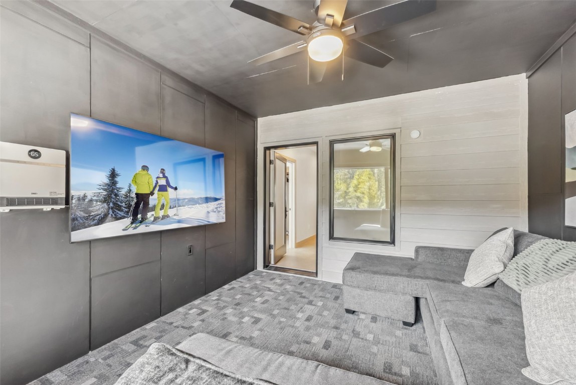 96 River Run Road, Unit A Keystone, CO 80435 - Photo 30 of 50 a bedroom with a bed and a chandelier