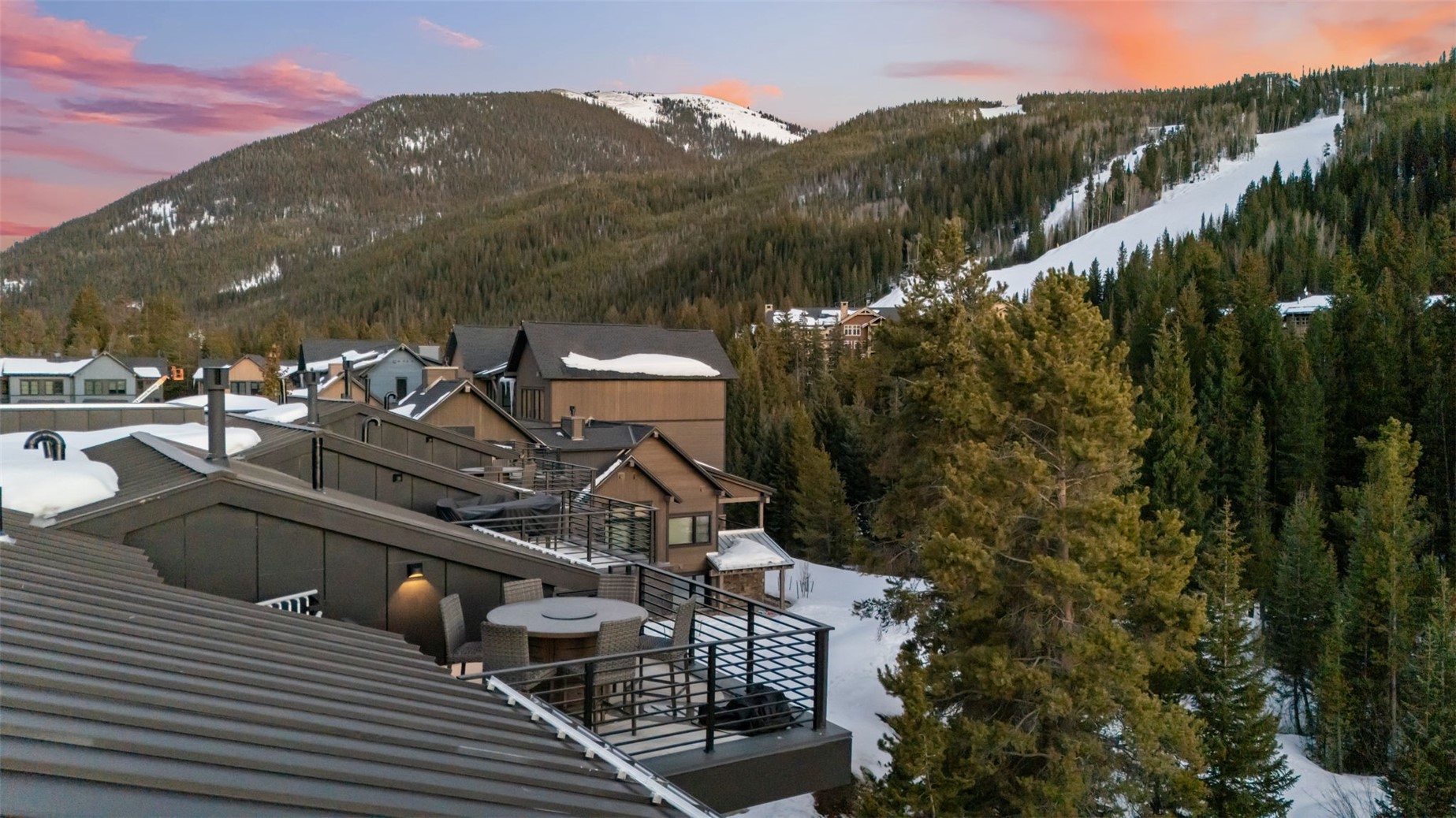 96 River Run Road, Unit A Keystone, CO 80435 - Photo 3 of 50 a view of a balcony with two chairs and a table