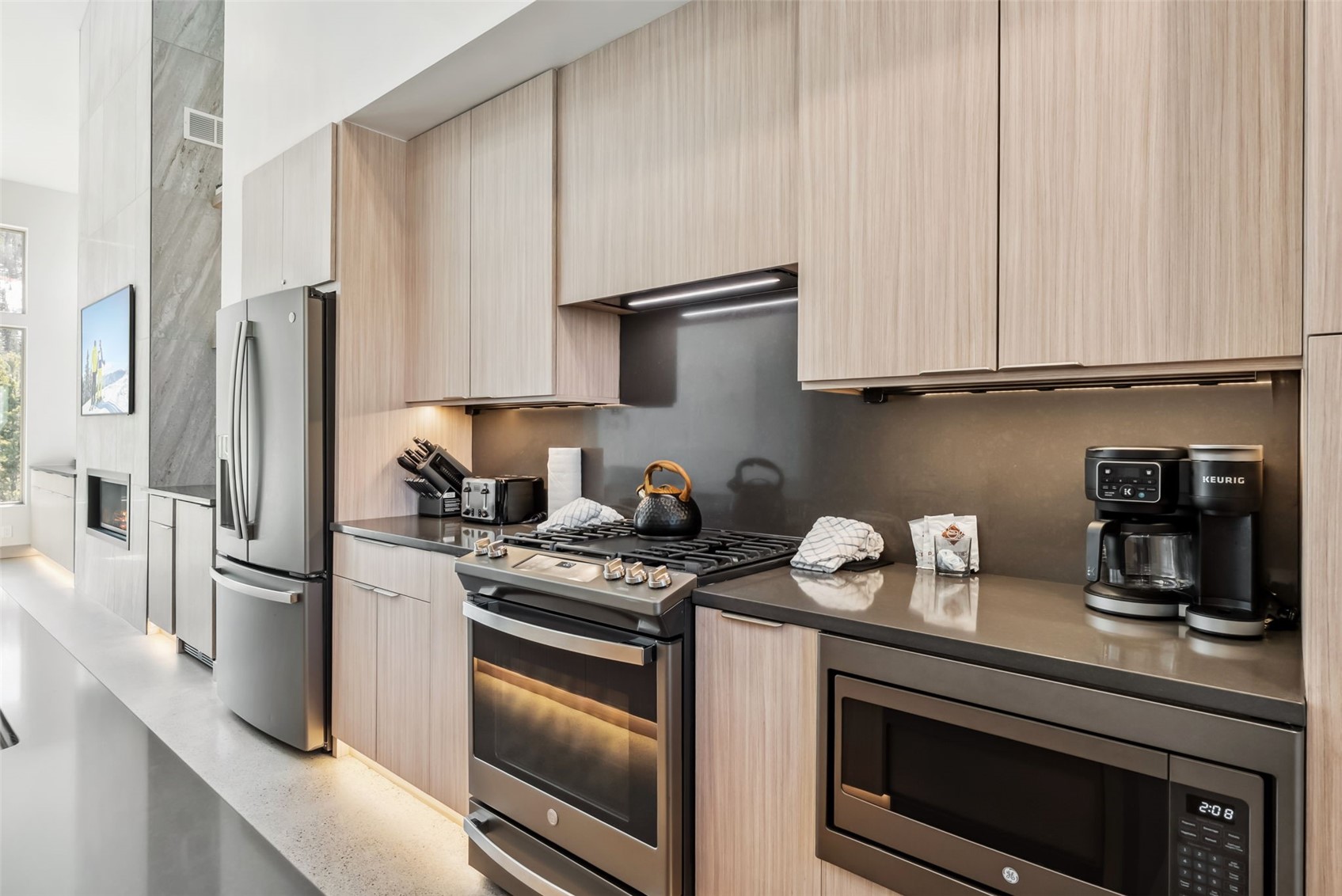 96 River Run Road, Unit A Keystone, CO 80435 - Photo 6 of 50 a kitchen with stainless steel appliances granite countertop a refrigerator stove and sink