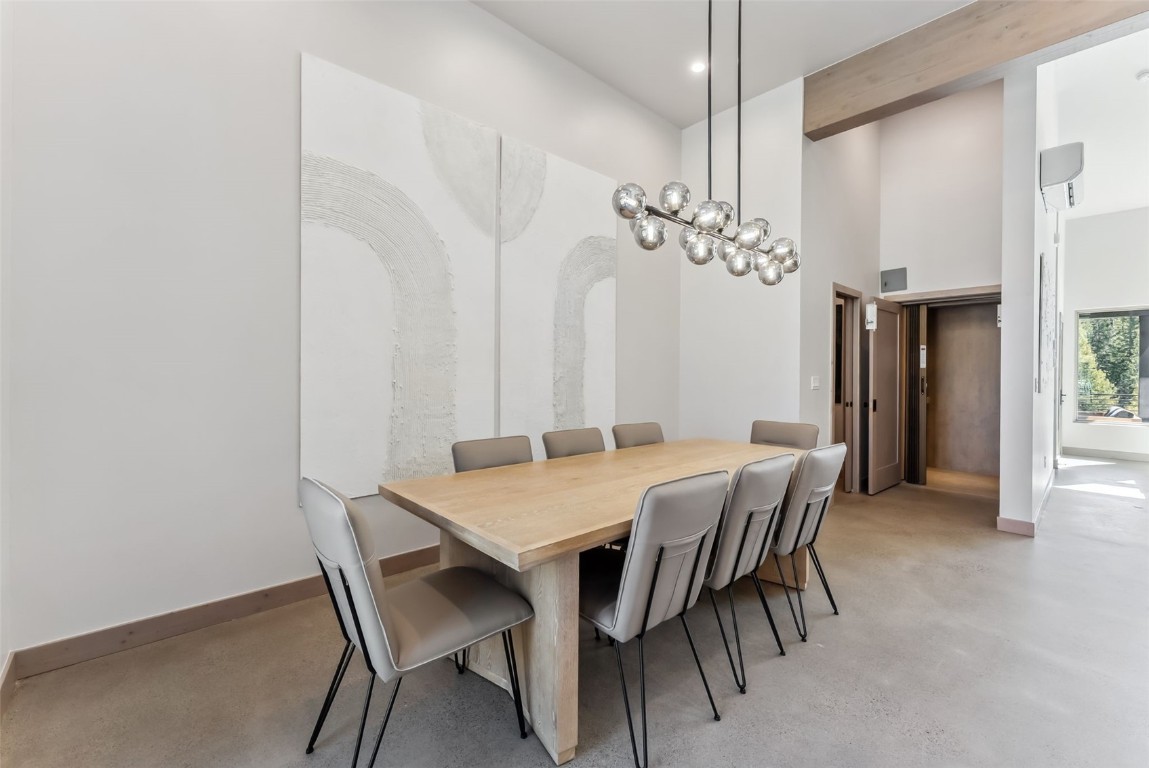 96 River Run Road, Unit A Keystone, CO 80435 - Photo 9 of 50 a view of a dining room with furniture and chandelier