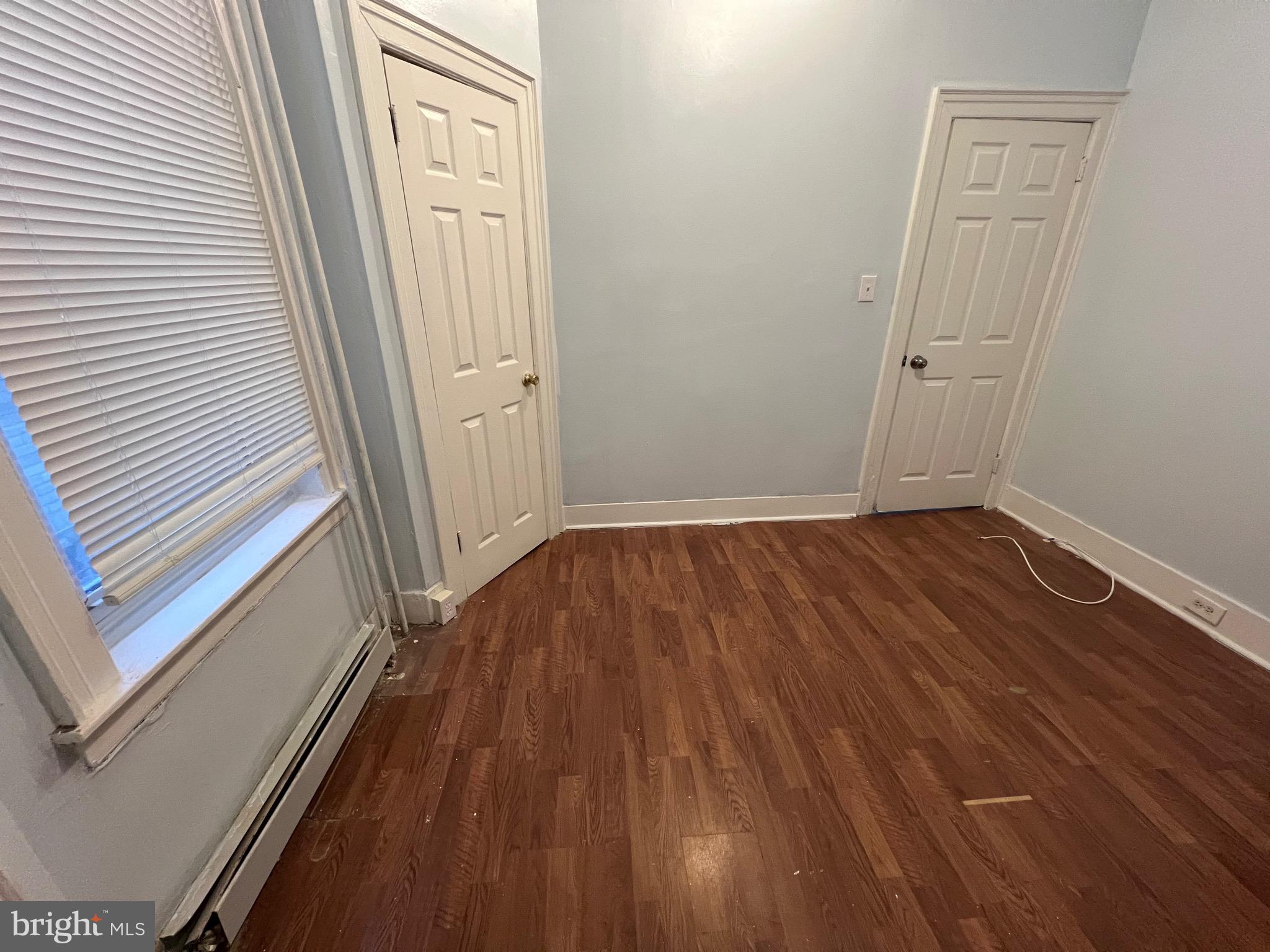 5533 Walnut Street, Unit 1 Philadelphia, PA 19139 - Photo 13 of 20 a view of a room with wooden floor and white walls