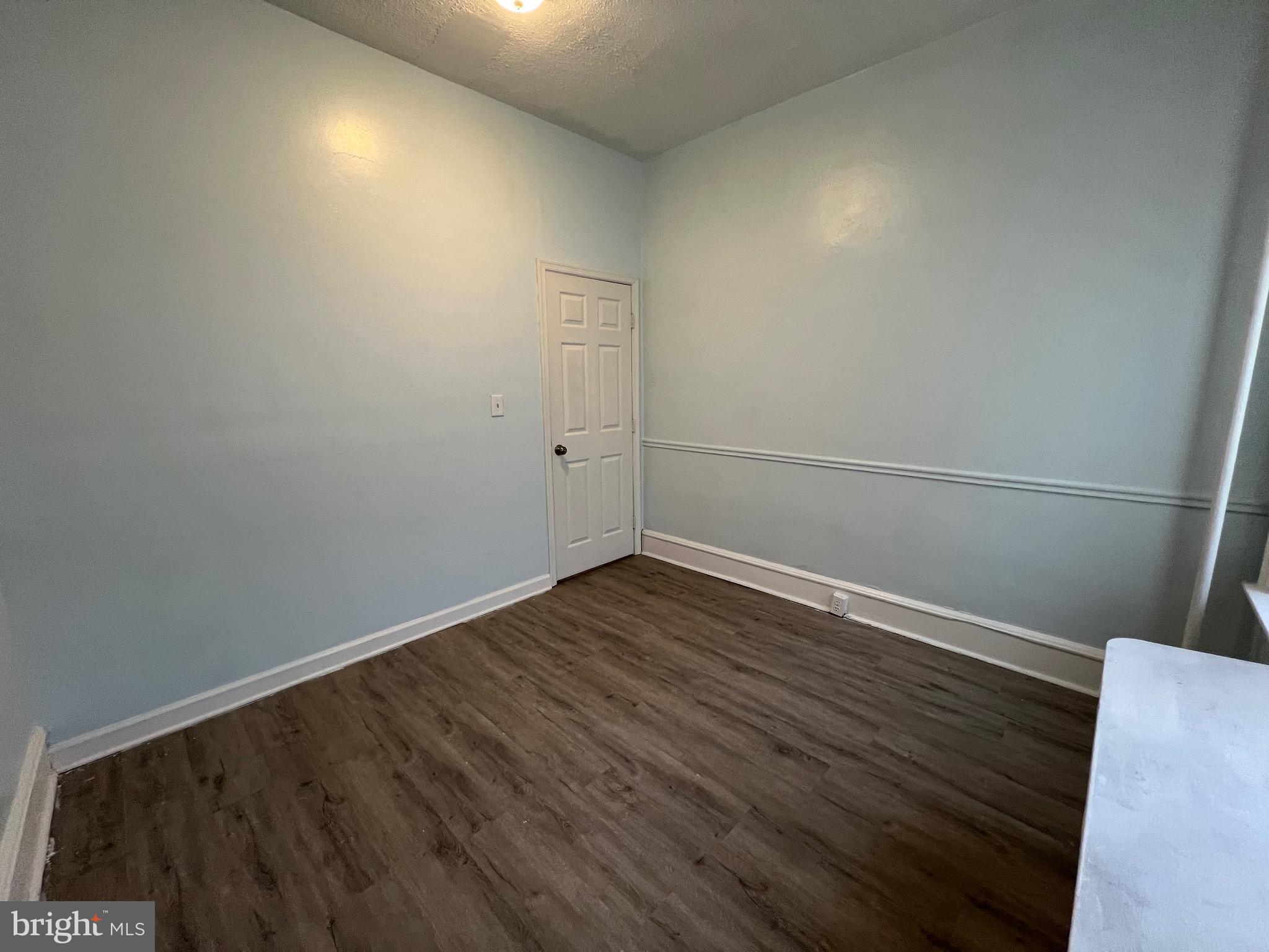 5533 Walnut Street, Unit 1 Philadelphia, PA 19139 - Photo 17 of 20 a view of an empty room with wooden floor