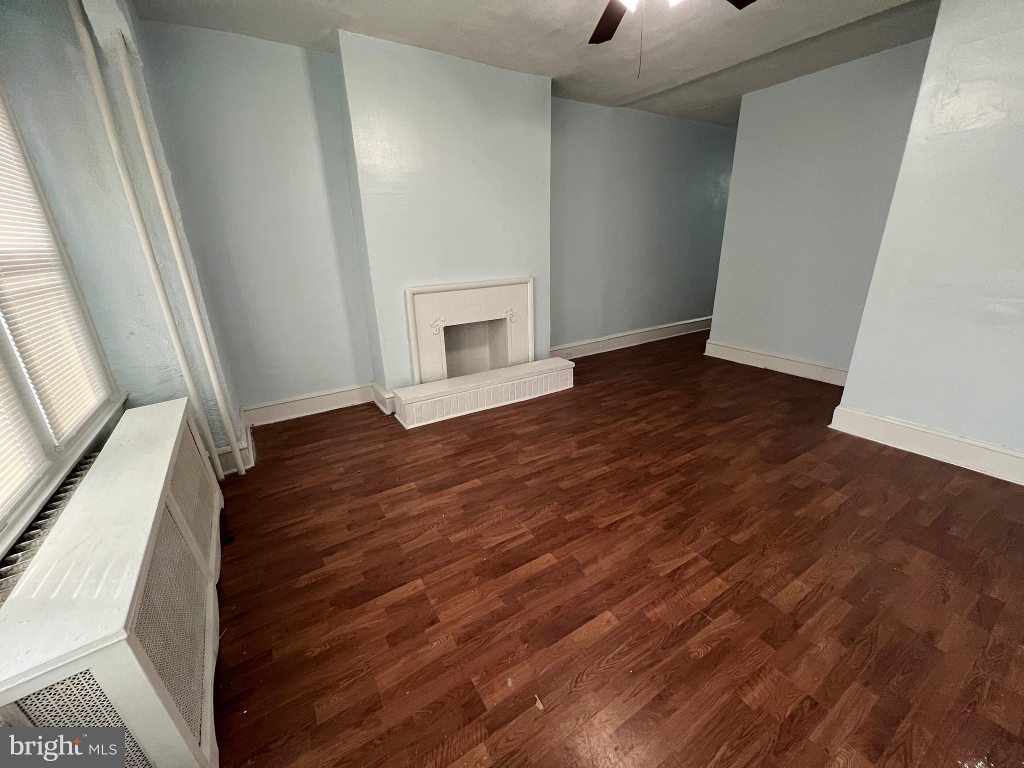 5533 Walnut Street, Unit 1 Philadelphia, PA 19139 - Photo 3 of 20 a view of an empty room with wooden floor and a window