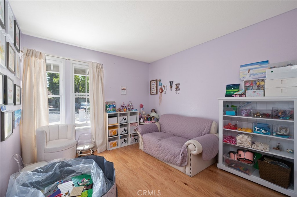 15241 Lille Circle Irvine, CA 92604 - Photo 11 of 38 a living room with furniture and a book shelf