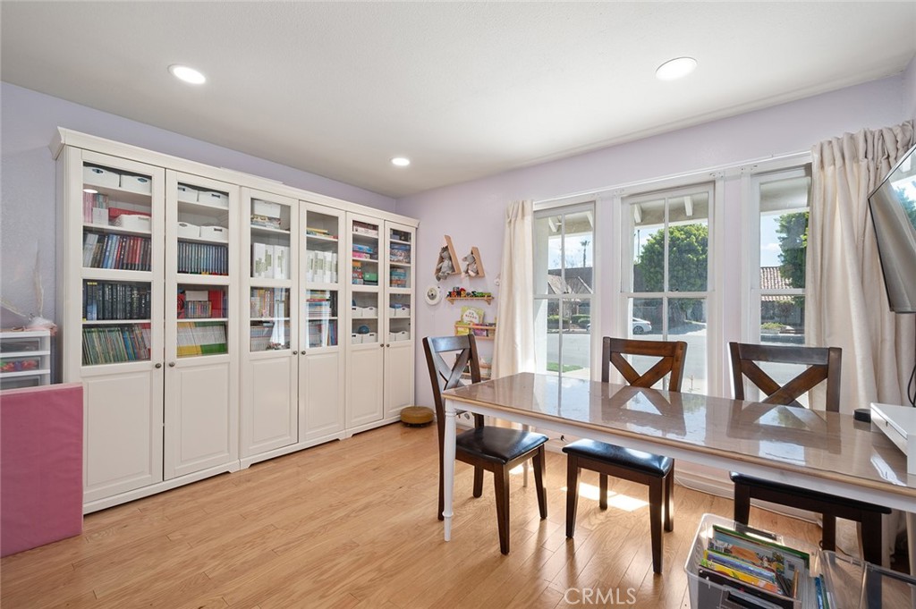 15241 Lille Circle Irvine, CA 92604 - Photo 13 of 38 a view of a dining room with furniture window and wooden floor