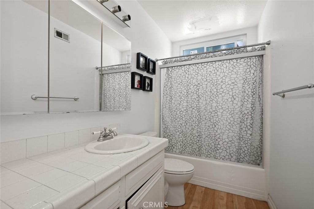 15241 Lille Circle Irvine, CA 92604 - Photo 15 of 38 a bathroom with a sink toilet and shower