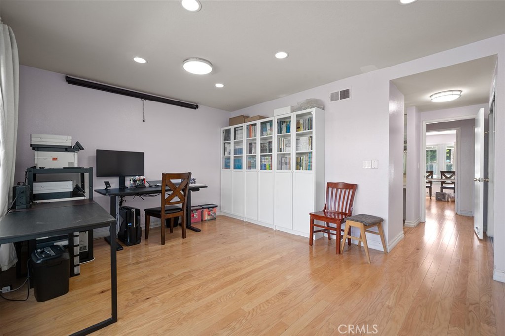 15241 Lille Circle Irvine, CA 92604 - Photo 17 of 38 a view of a dining room with furniture and wooden floor
