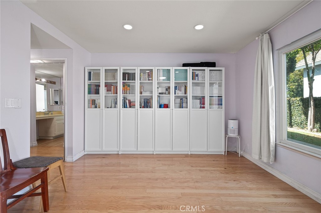 15241 Lille Circle Irvine, CA 92604 - Photo 18 of 38 an empty room with wooden floor and windows