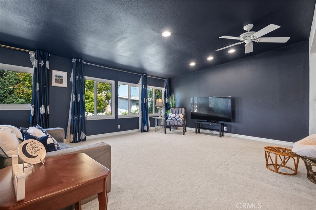 15241 Lille Circle Irvine, CA 92604 - Photo 28 of 38 a view of a livingroom with furniture and a flat screen tv