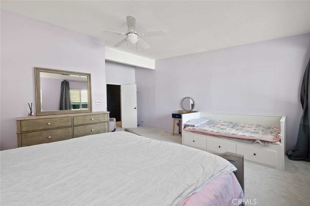 15241 Lille Circle Irvine, CA 92604 - Photo 30 of 38 a bedroom with a bed and a mirror