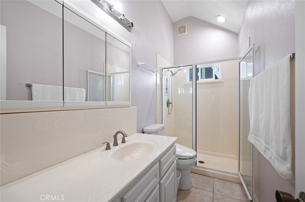 15241 Lille Circle Irvine, CA 92604 - Photo 31 of 38 a bathroom with a sink a toilet and shower