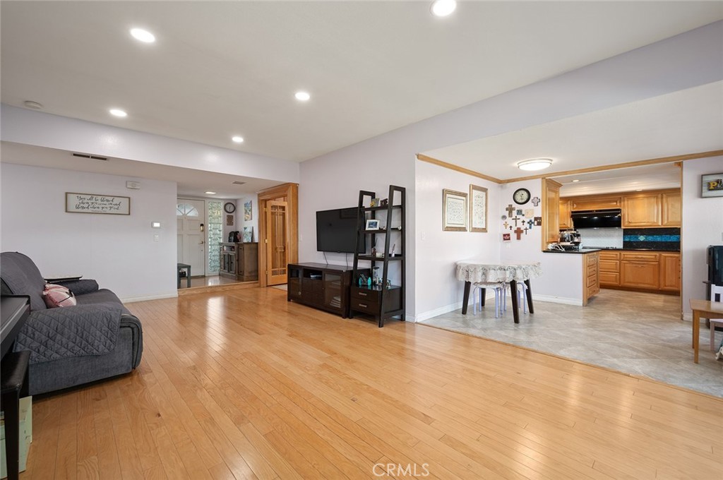 15241 Lille Circle Irvine, CA 92604 - Photo 4 of 38 a living room with furniture and a flat screen tv