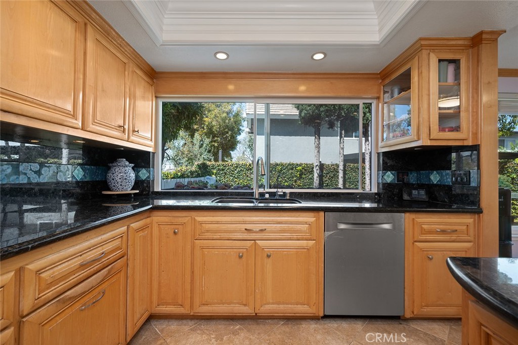 15241 Lille Circle Irvine, CA 92604 - Photo 8 of 38 a kitchen with stainless steel appliances granite countertop a stove a sink and a microwave