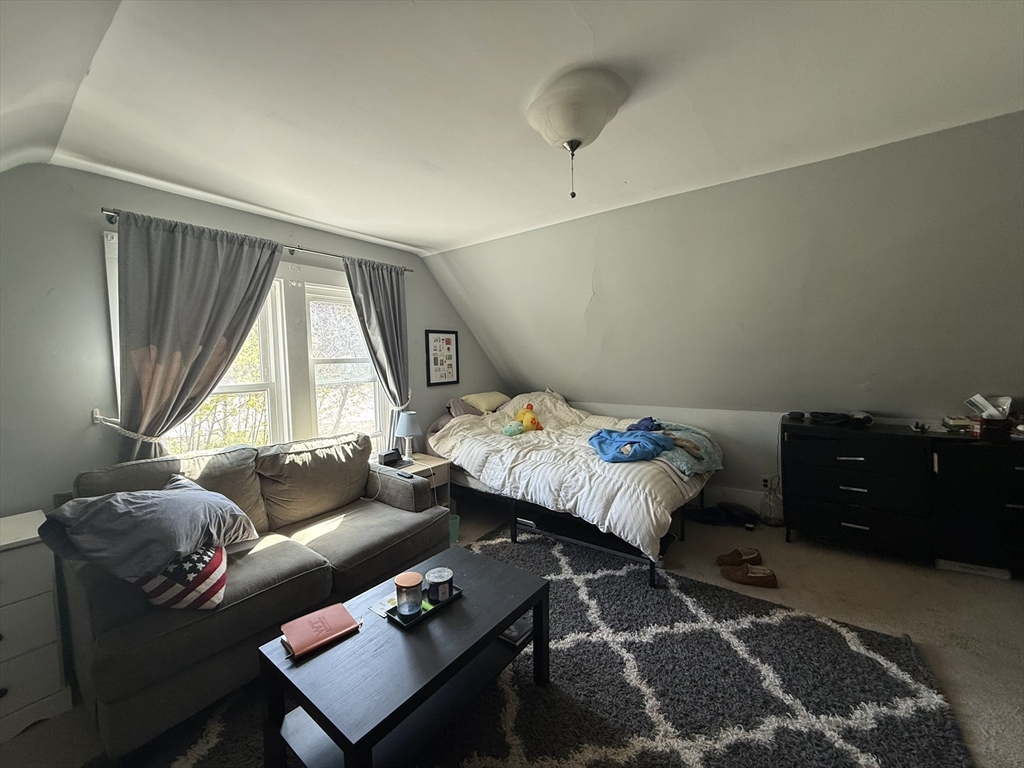 4 Barstow Street Boston, MA 02134 - Photo 20 of 21 a bedroom with a bed and wooden floor