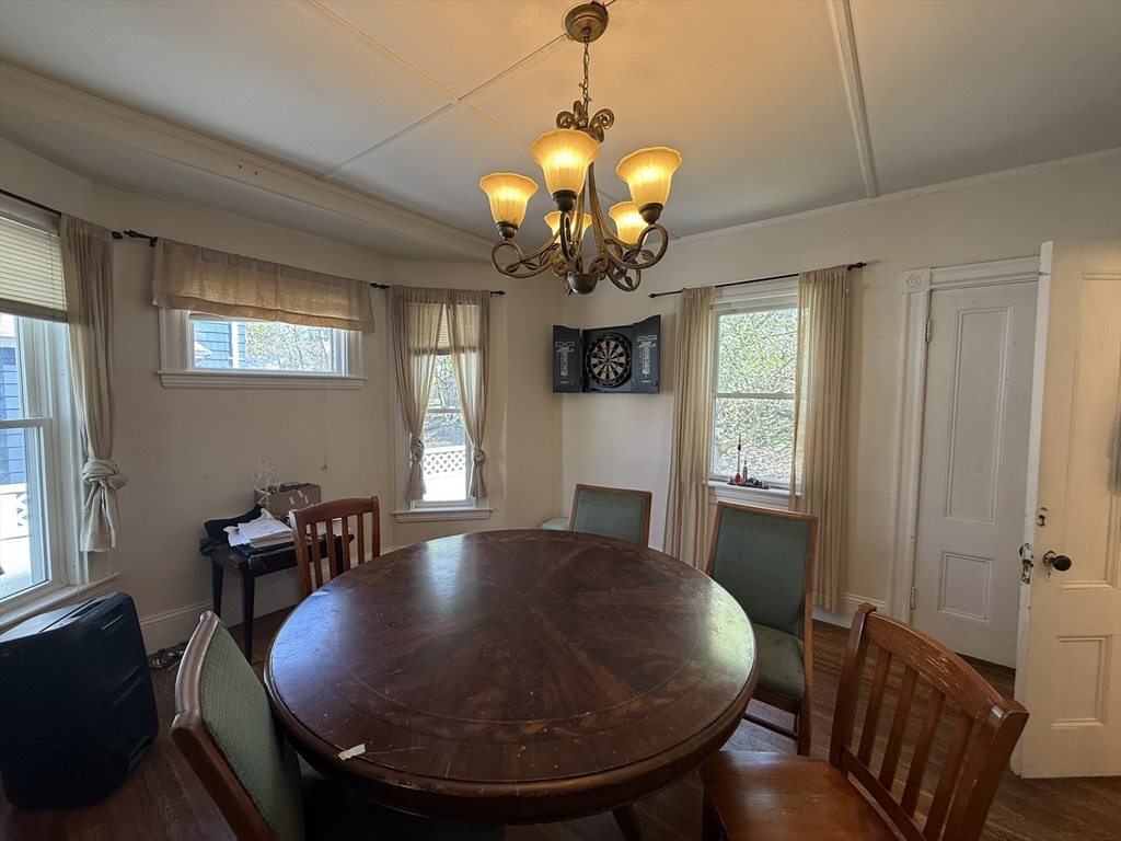 4 Barstow Street Boston, MA 02134 - Photo 5 of 21 a view of a dining room with furniture and chandelier