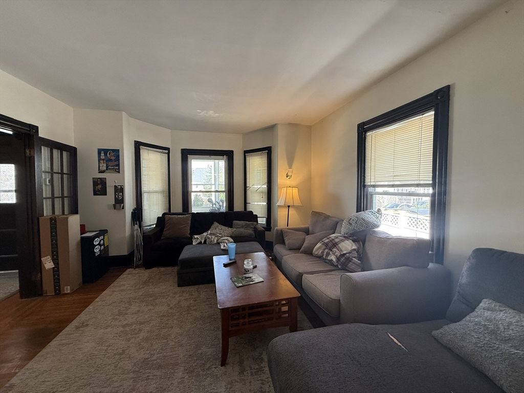 4 Barstow Street Boston, MA 02134 - Photo 7 of 21 a living room with furniture and a window