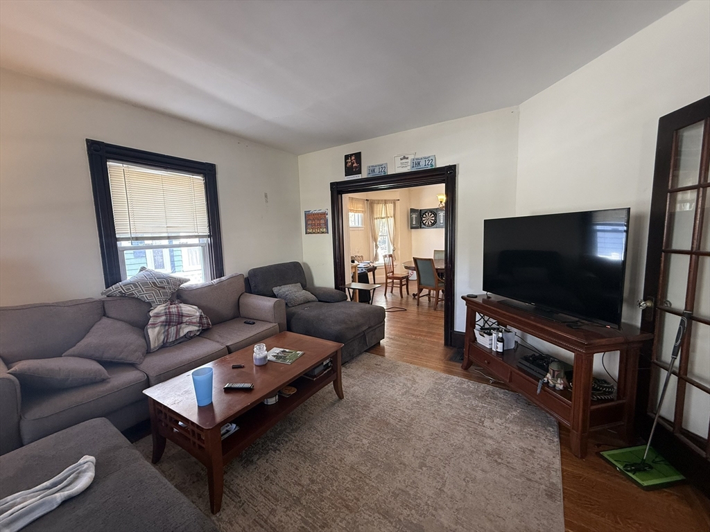 4 Barstow Street Boston, MA 02134 - Photo 8 of 21 a living room with furniture and a flat screen tv