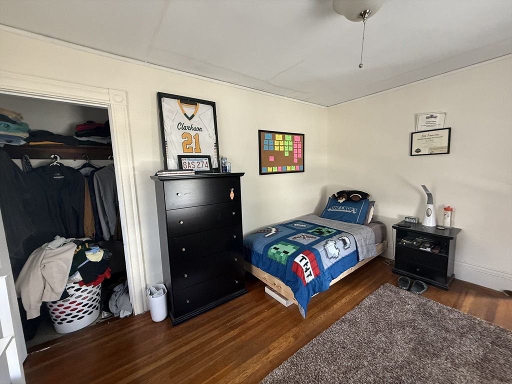4 Barstow Street Boston, MA 02134 - Photo 10 of 21 a living room with furniture and a baby crib