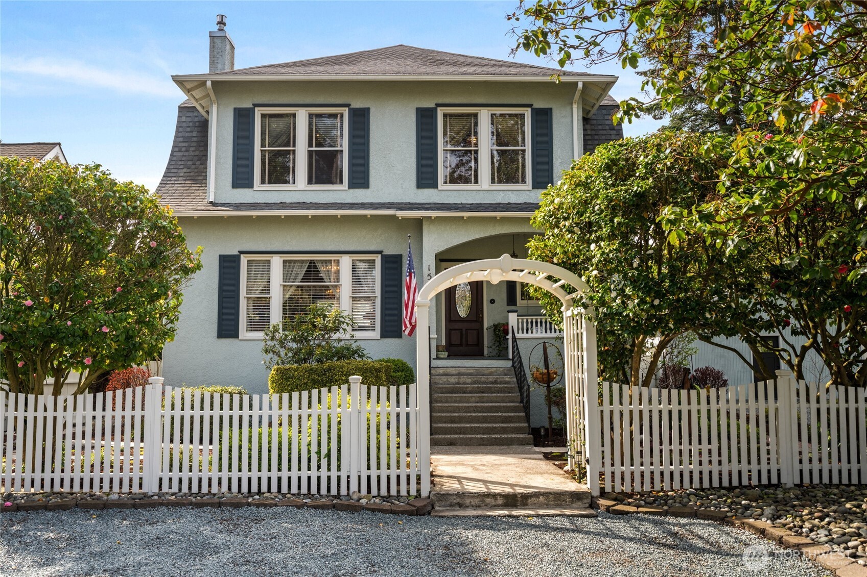 a front view of a house with tree s