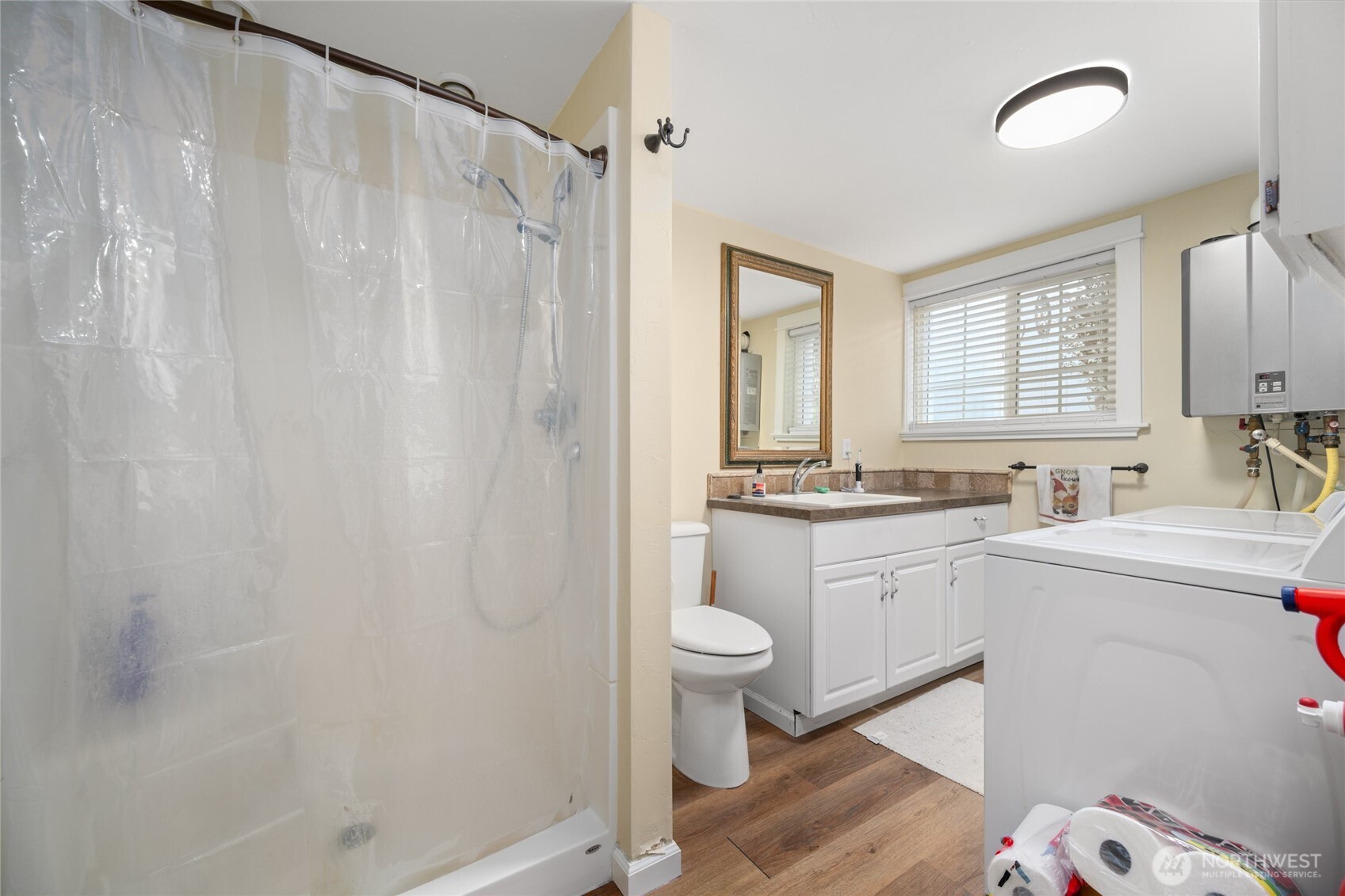 1507 15th Street Anacortes, WA 98221 - Photo 19 of 40 a bathroom with a sink toilet and shower