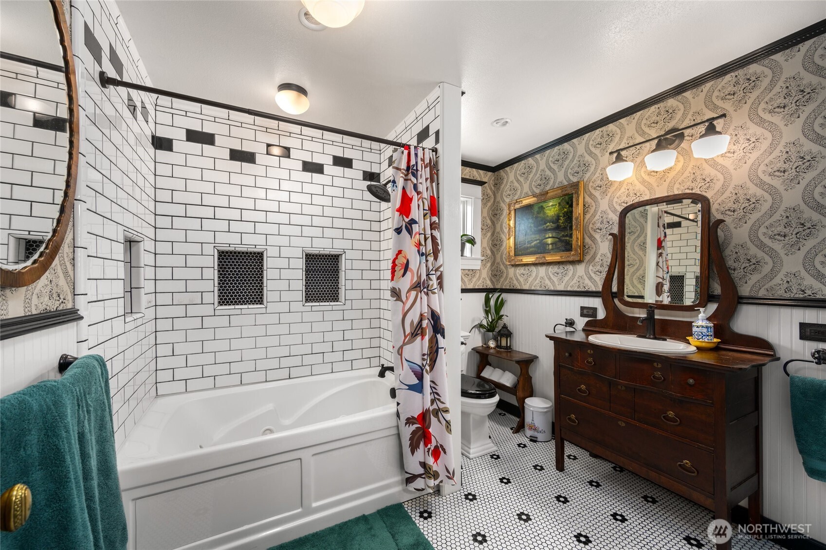 1507 15th Street Anacortes, WA 98221 - Photo 22 of 40 a bathroom with a sink a bathtub and a shower
